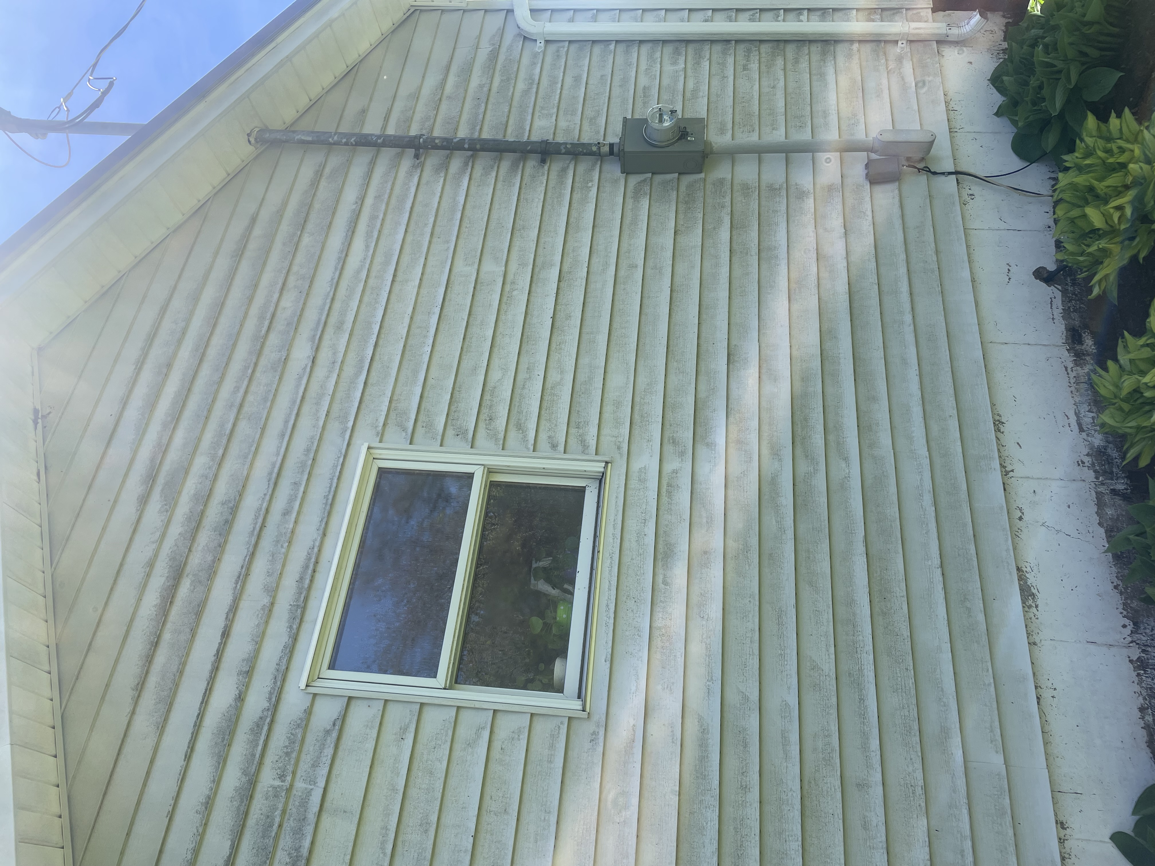 Stained siding before cleaning